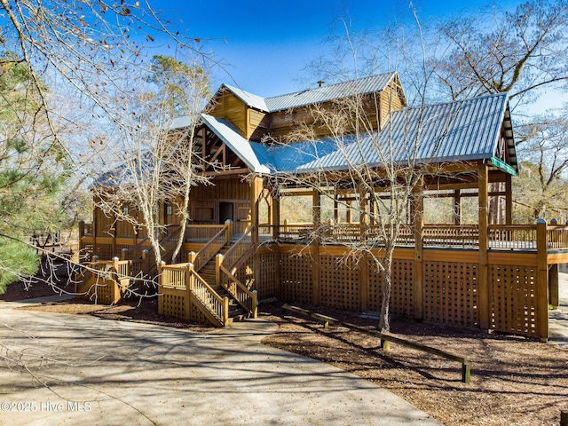 249 Maple Creek Dr, Wallace, NC 28466 - view of front of property with a porch, a metal roof, and stairway