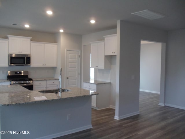8711 Baton Rouge Ave NW Lot 1156, Calabash, NC 28467 - kitchen with appliances with stainless steel finishes, a sink, light stone counters, tasteful backsplash, and recessed lighting