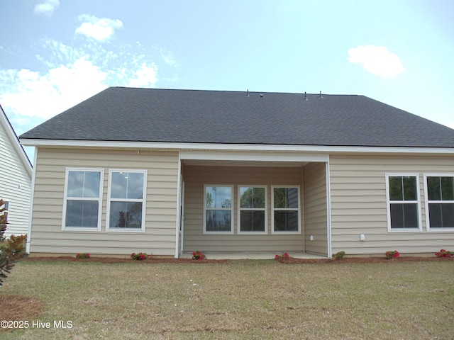 8711 Baton Rouge Ave NW Lot 1156, Calabash, NC 28467 - rear view of property featuring a yard