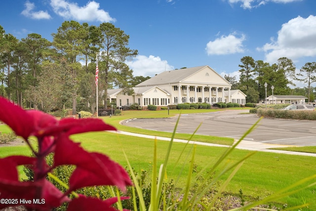 8711 Baton Rouge Ave NW Lot 1156, Calabash, NC 28467 - surrounding community featuring uncovered parking and a yard