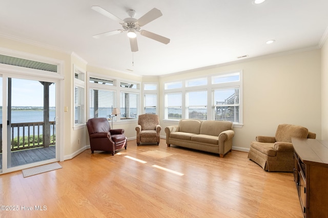 8630 Sound Dr Unit B2, Emerald Isle, NC 28594 - living area featuring light wood finished floors, crown molding, a water view, a ceiling fan, and recessed lighting