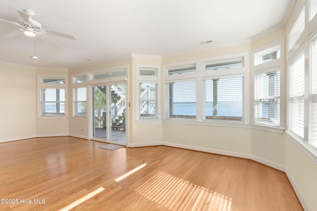 8630 Sound Dr Unit B2, Emerald Isle, NC 28594 - spare room with light wood-style flooring, crown molding, and a ceiling fan