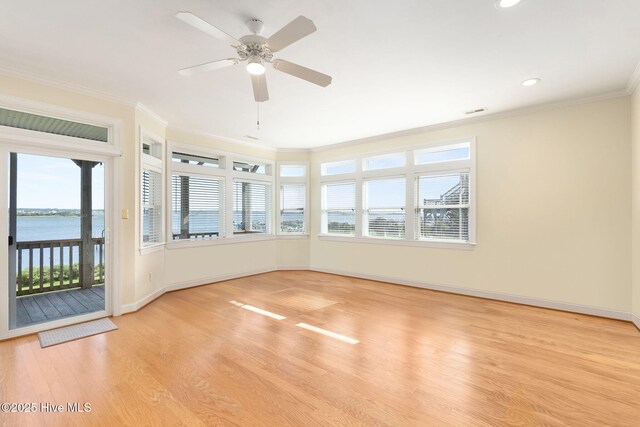 8630 Sound Dr Unit B2, Emerald Isle, NC 28594 - unfurnished room featuring light wood-type flooring, crown molding, a ceiling fan, a water view, and recessed lighting