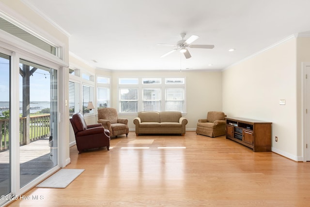 8630 Sound Dr Unit B2, Emerald Isle, NC 28594 - living area with healthy amount of natural light, light wood finished floors, ceiling fan, ornamental molding, and recessed lighting