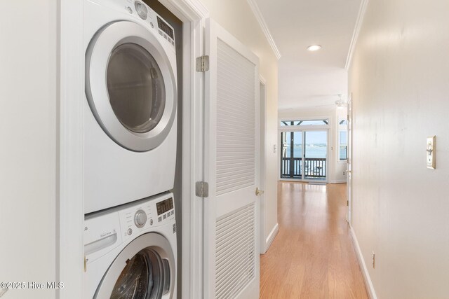 8630 Sound Dr Unit B2, Emerald Isle, NC 28594 - laundry room with estacked washer and dryer, ornamental molding, light wood-type flooring, ceiling fan, and recessed lighting