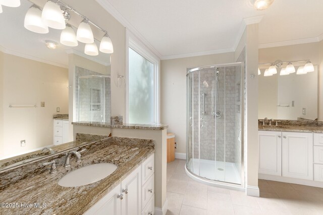 8630 Sound Dr Unit B2, Emerald Isle, NC 28594 - full bathroom with a stall shower, tile patterned flooring, two vanities, and crown molding