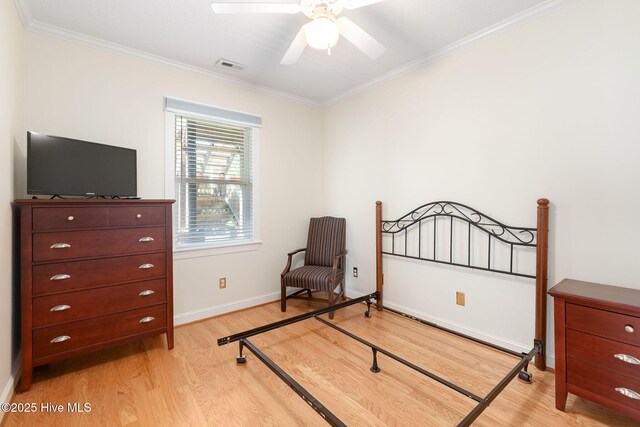 8630 Sound Dr Unit B2, Emerald Isle, NC 28594 - bedroom featuring light wood finished floors, ornamental molding, and ceiling fan