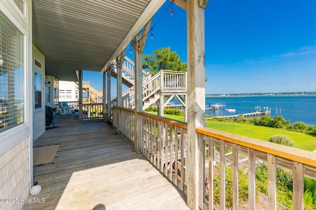 8630 Sound Dr Unit B2, Emerald Isle, NC 28594 - wooden terrace with a water view and stairs