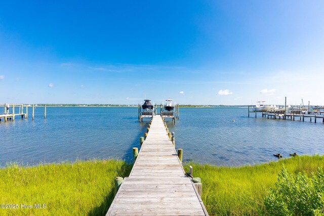 8630 Sound Dr Unit B2, Emerald Isle, NC 28594 - dock with a water view and boat lift