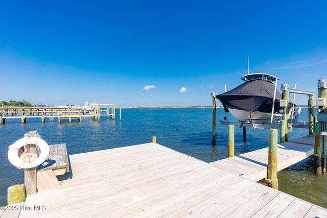 8630 Sound Dr Unit B2, Emerald Isle, NC 28594 - dock area with boat lift and a water view