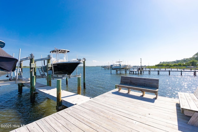 8630 Sound Dr Unit B2, Emerald Isle, NC 28594 - dock featuring boat lift and a water view