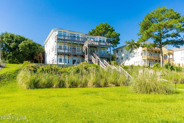 8630 Sound Dr Unit B2, Emerald Isle, NC 28594 - back of property featuring a wooden deck and a lawn