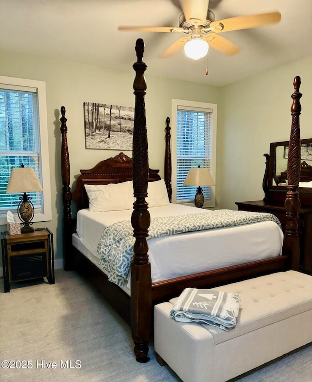1044 Mill Creek Rd, Minnesott Beach, NC 28510 - bedroom featuring multiple windows, ceiling fan, and carpet floors