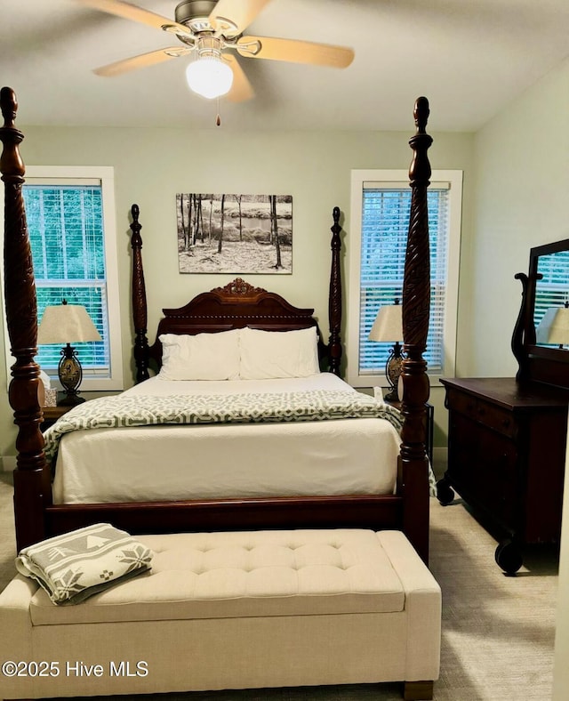 1044 Mill Creek Rd, Minnesott Beach, NC 28510 - carpeted bedroom featuring multiple windows and ceiling fan