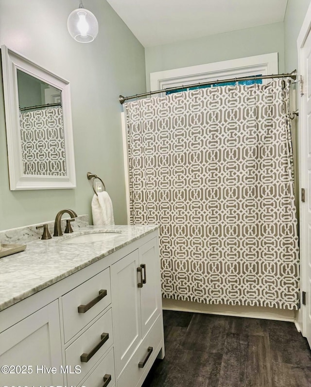 1044 Mill Creek Rd, Minnesott Beach, NC 28510 - bathroom with vanity, wood finished floors, and curtained shower