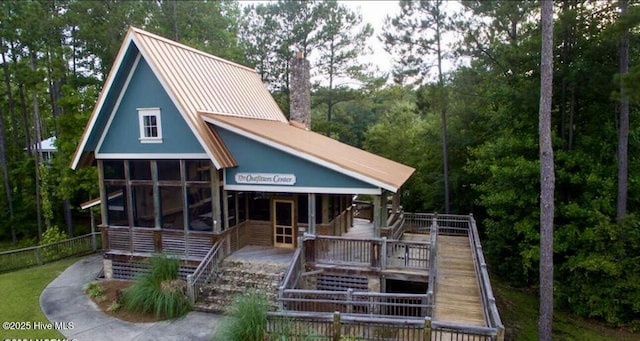 1044 Mill Creek Rd, Minnesott Beach, NC 28510 - view of front of house featuring stairs and metal roof