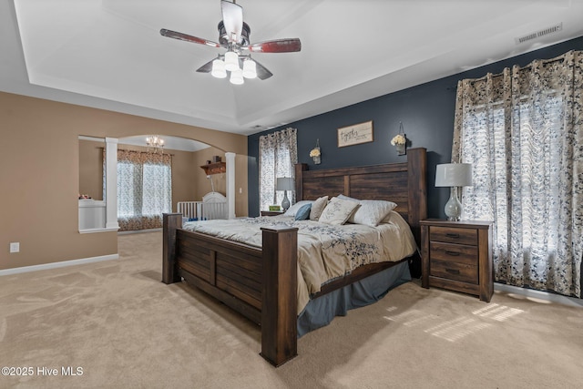 399 Highgrove Dr, Spring Lake, NC 28390 - bedroom featuring carpet floors, a raised ceiling, baseboards, arched walkways, and ceiling fan