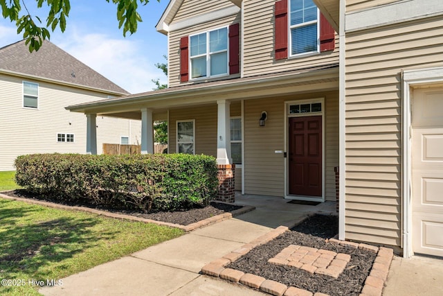 399 Highgrove Dr, Spring Lake, NC 28390 - property entrance featuring a garage and covered porch