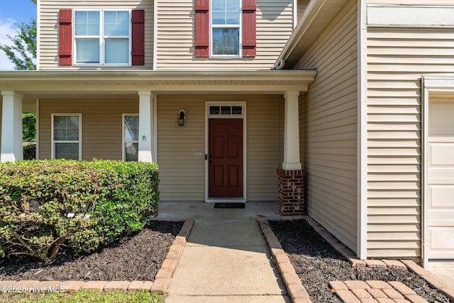 399 Highgrove Dr, Spring Lake, NC 28390 - doorway to property featuring a porch
