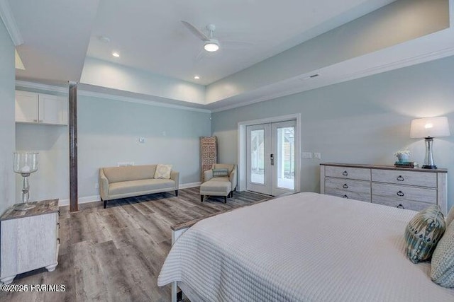 640 Avila Dr, Hampstead, NC 28443 - bedroom featuring wood finished floors, access to exterior, french doors, baseboards, and a raised ceiling