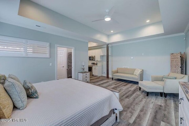 640 Avila Dr, Hampstead, NC 28443 - bedroom with a tray ceiling, light wood-type flooring, crown molding, recessed lighting, and a ceiling fan