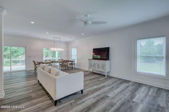 640 Avila Dr, Hampstead, NC 28443 - living room with a ceiling fan, baseboards, wood finished floors, ornamental molding, and recessed lighting