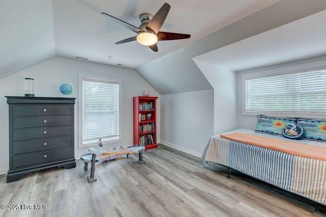 640 Avila Dr, Hampstead, NC 28443 - bedroom featuring wood finished floors, vaulted ceiling, multiple windows, baseboards, and a ceiling fan