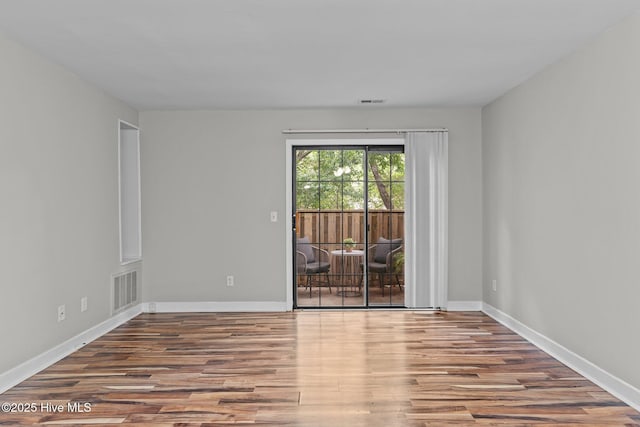 1703 41st St Apt B, Wilmington, NC 28403 - empty room featuring wood finished floors