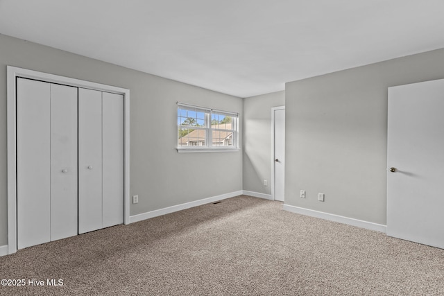 1703 41st St Apt B, Wilmington, NC 28403 - unfurnished bedroom with carpet floors and a closet