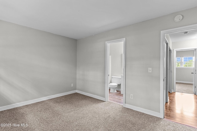 1703 41st St Apt B, Wilmington, NC 28403 - unfurnished bedroom with carpet floors and ensuite bathroom