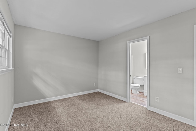 1703 41st St Apt B, Wilmington, NC 28403 - unfurnished bedroom featuring carpet floors and ensuite bathroom