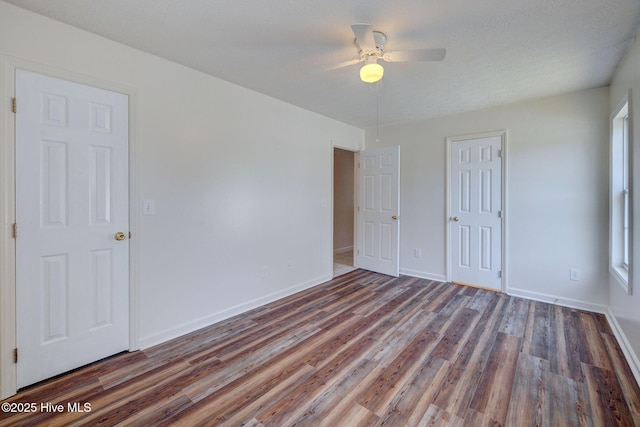 6901 Southern Exposure, Wilmington, NC 28412 - unfurnished bedroom featuring wood finished floors, baseboards, and ceiling fan