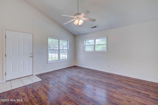 6901 Southern Exposure, Wilmington, NC 28412 - foyer entrance featuring wood finished floors, ceiling fan, vaulted ceiling, baseboards, and a textured ceiling