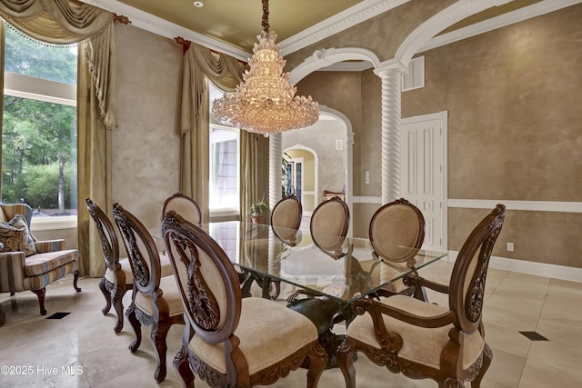 3530 Van Buren St SW, Supply, NC 28462 - dining area with light tile patterned floors, arched walkways, decorative columns, and crown molding