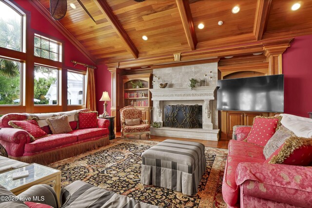 3530 Van Buren St SW, Supply, NC 28462 - living room with a wooden ceiling with exposed beams, wood finished floors, built in shelves, a high end fireplace, and high vaulted ceiling