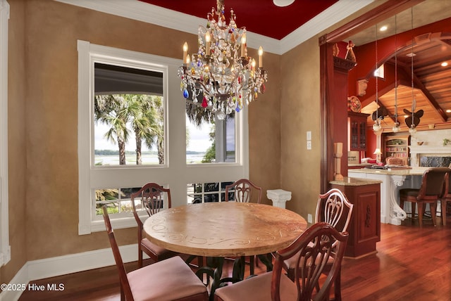 3530 Van Buren St SW, Supply, NC 28462 - dining room featuring healthy amount of natural light, dark wood-style floors, ornamental molding, and vaulted ceiling