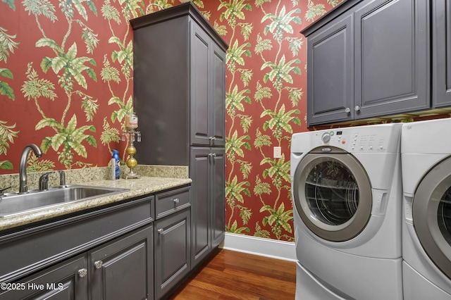 3530 Van Buren St SW, Supply, NC 28462 - laundry room featuring wallpapered walls, cabinet space, washer and clothes dryer, and dark wood-type flooring
