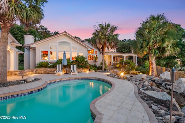 3530 Van Buren St SW, Supply, NC 28462 - pool at dusk with an outdoor pool and a patio area