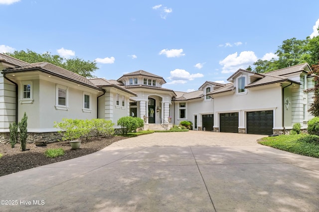 3530 Van Buren St SW, Supply, NC 28462 - view of front of property featuring driveway, an attached garage, stone siding, and stucco siding