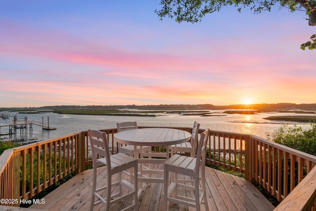 3530 Van Buren St SW, Supply, NC 28462 - deck at dusk featuring a water view and a boat dock