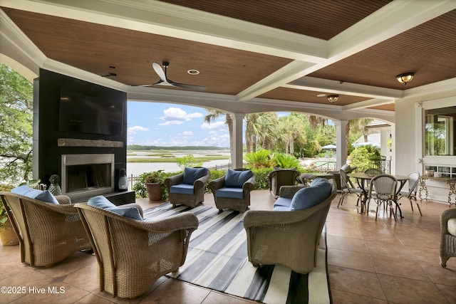 3530 Van Buren St SW, Supply, NC 28462 - view of patio / terrace with an outdoor living space with a fireplace, a ceiling fan, and outdoor dining space