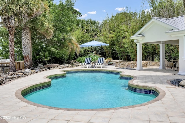 3530 Van Buren St SW, Supply, NC 28462 - outdoor pool featuring a patio area and view of wooded area