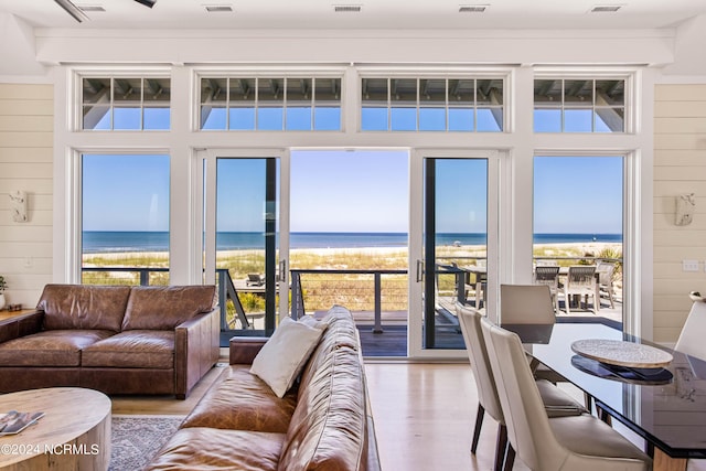 224 W Bald Head Wynd Wynd, Bald Head Island, NC 28461 - living room featuring wood finished floors and view of water and beach
