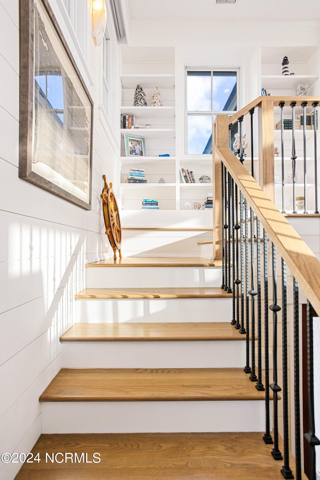 224 W Bald Head Wynd Wynd, Bald Head Island, NC 28461 - stairway featuring wood finished floors