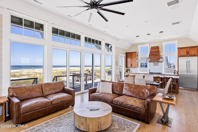 224 W Bald Head Wynd Wynd, Bald Head Island, NC 28461 - living room featuring light wood-type flooring, lofted ceiling, ceiling fan, and a water view