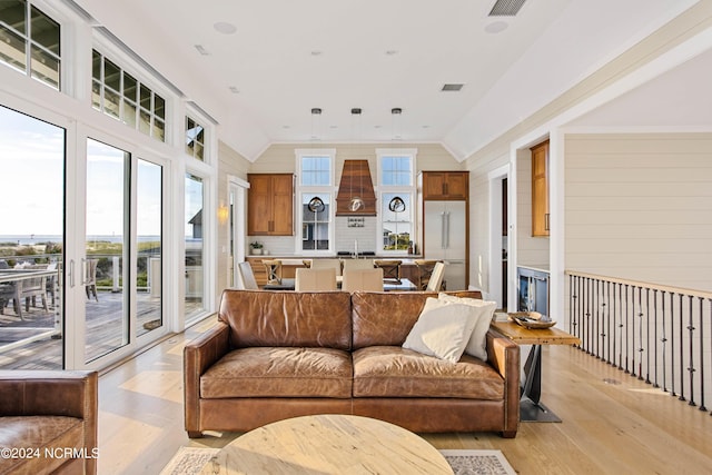 224 W Bald Head Wynd Wynd, Bald Head Island, NC 28461 - living area featuring light wood finished floors, lofted ceiling, and wood walls