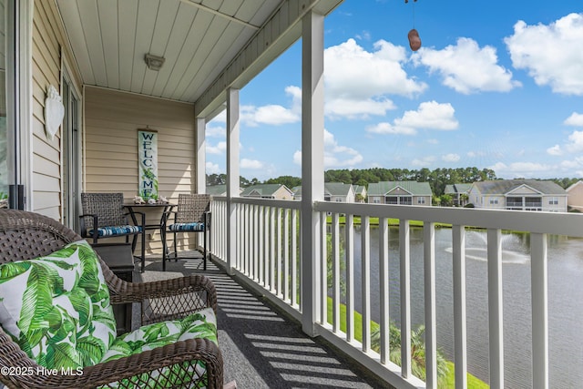 881 Great Egret Cir Unit F, Sunset Beach, NC 28468 - balcony with a residential view and a water view