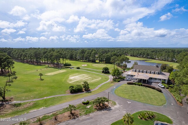 881 Great Egret Cir Unit F, Sunset Beach, NC 28468 - bird's eye view of a large body of water and a golf course