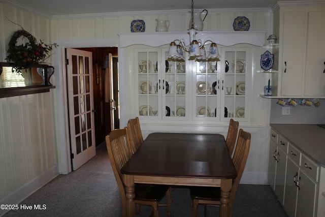 2945 US Highway 17, Williamston, NC 27892 - carpeted dining room with a chandelier and crown molding