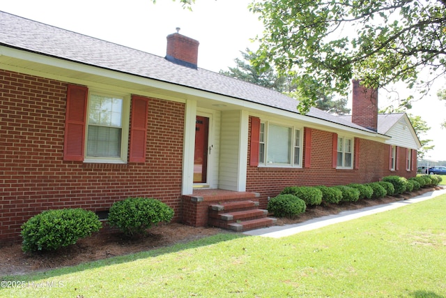2945 US Highway 17, Williamston, NC 27892 - view of front facade featuring brick siding, a front lawn, and a chimney